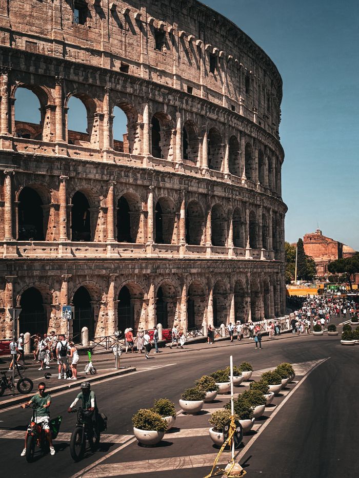 Crafting Captivating Headlines: Your awesome post title goes here Iconic Colosseum in Rome, showcasing architectural grandeur amidst bustling tourists.